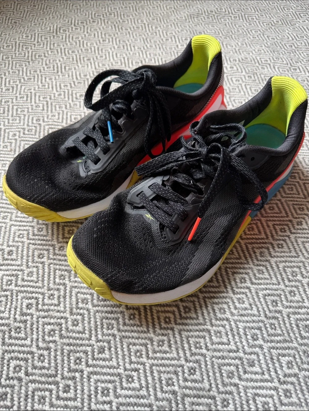 Reebok Nano X1 Black Running Shoes with Yellow, Red and Blue Accents